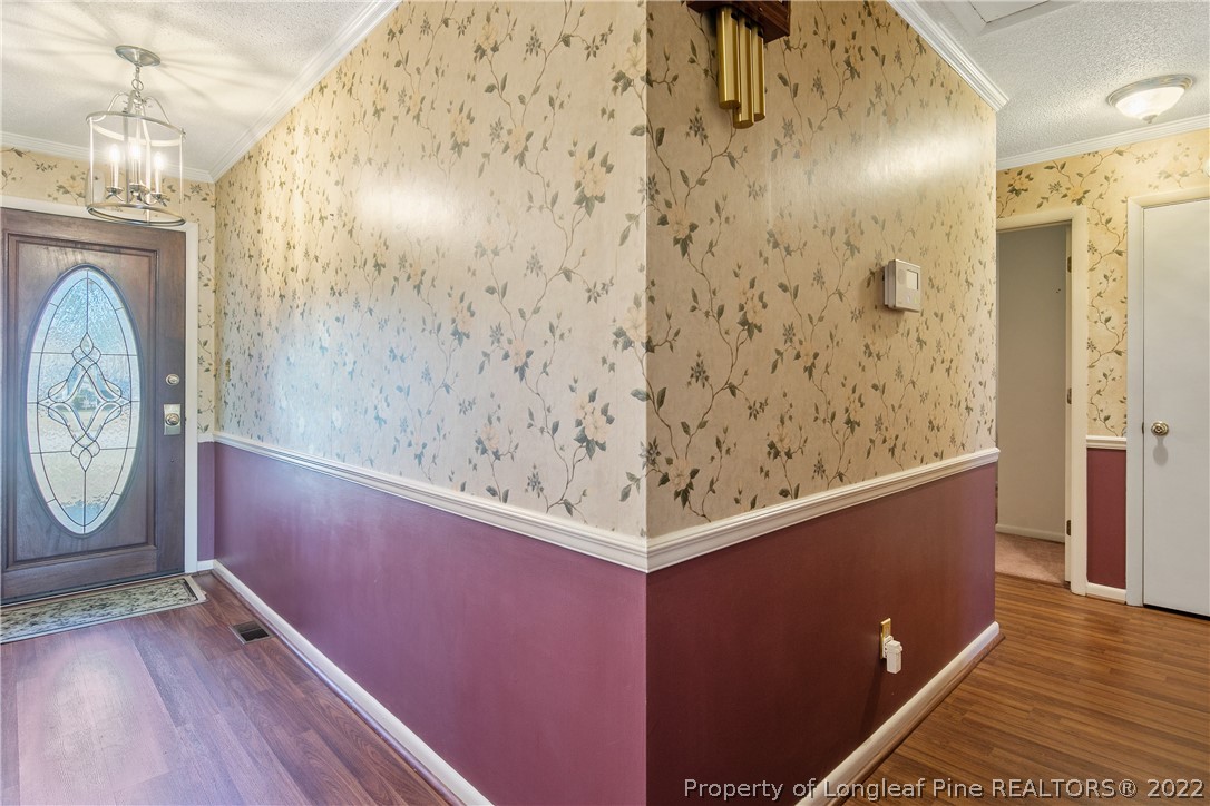 211 Duncan Road Spring Lake, NC 28390 - Photo 6 of 46 a view of small space with wooden floor and hallway