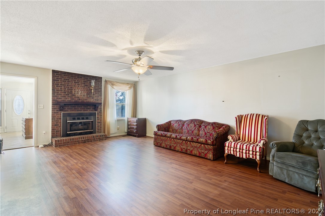 211 Duncan Road Spring Lake, NC 28390 - Photo 9 of 46 a living room with furniture and a fireplace