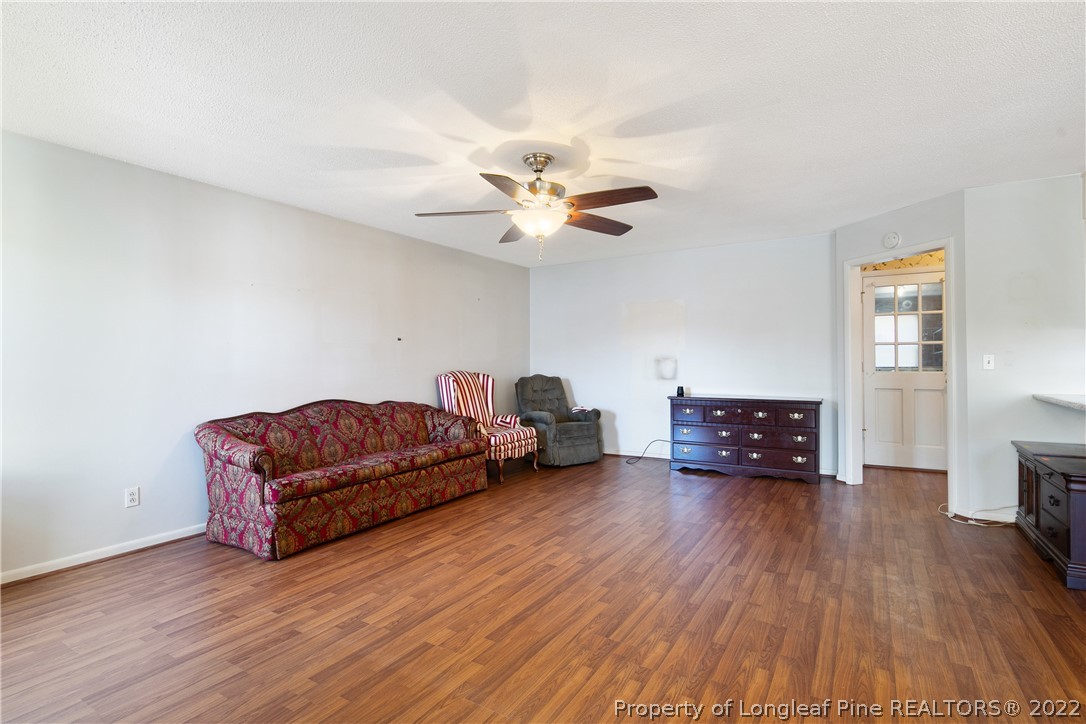 211 Duncan Road Spring Lake, NC 28390 - Photo 10 of 46 a living room with furniture and a wooden floor