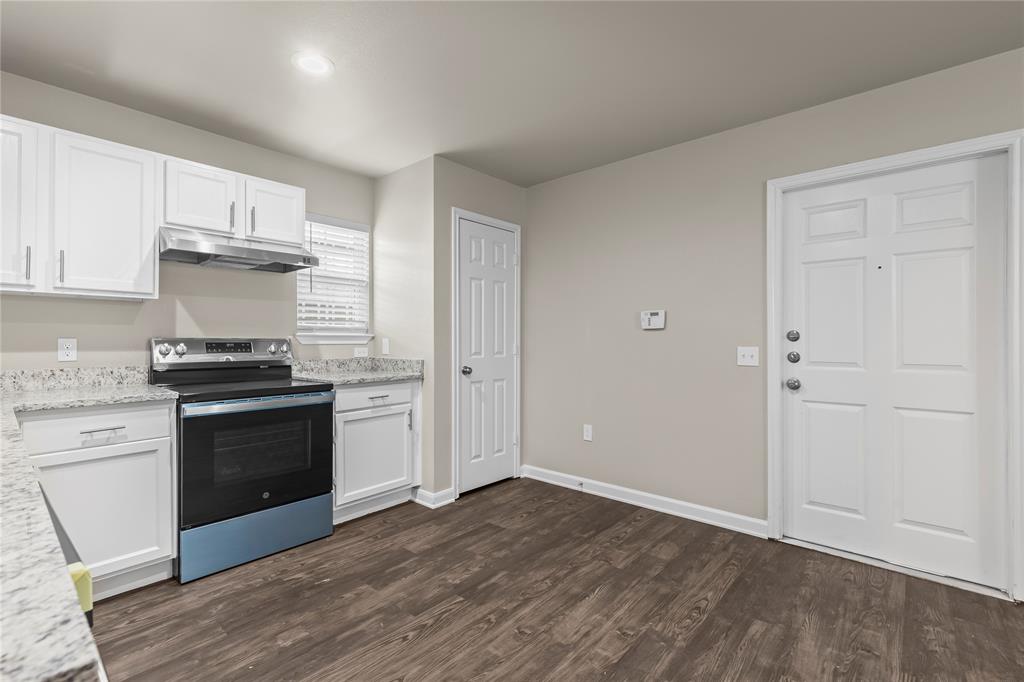 2723 Parsons Street Dallas, TX 75215 - Photo 12 of 28 a kitchen with granite countertop a stove and a sink