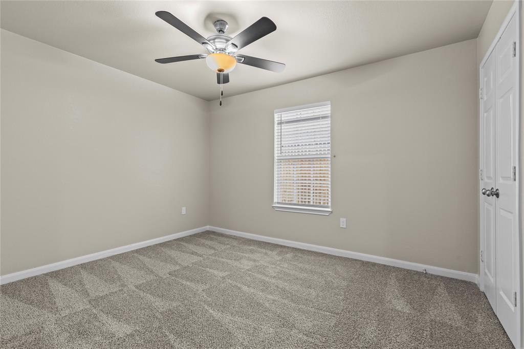 2723 Parsons Street Dallas, TX 75215 - Photo 16 of 28 an empty room with a window and a ceiling fan