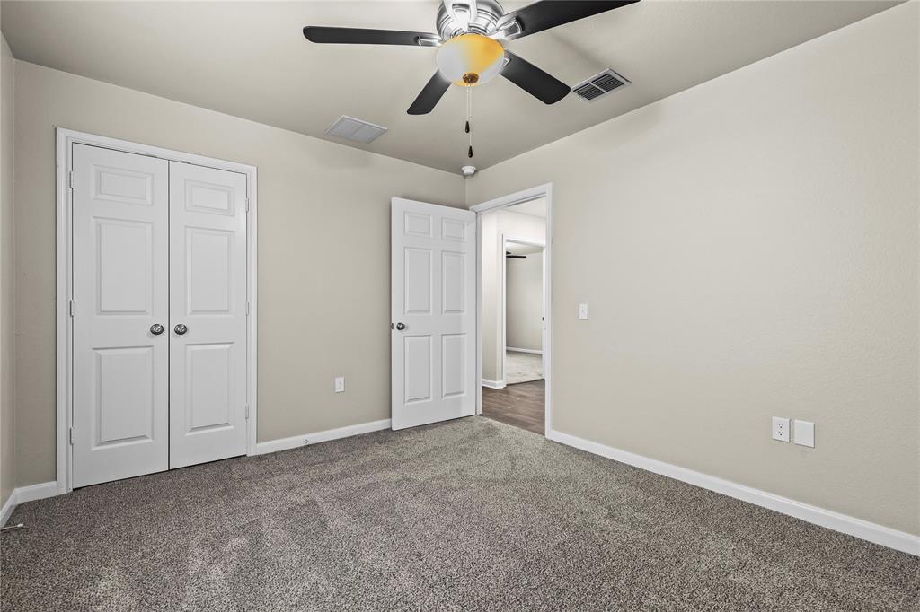 2723 Parsons Street Dallas, TX 75215 - Photo 17 of 28 a view of an empty room and chandelier fan