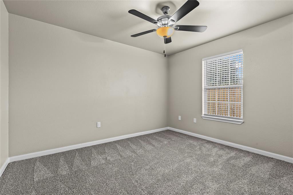 2723 Parsons Street Dallas, TX 75215 - Photo 18 of 28 an empty room with a window and a fan
