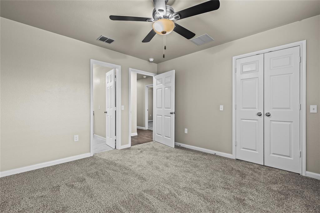 2723 Parsons Street Dallas, TX 75215 - Photo 21 of 28 a view of an empty room and chandelier fan