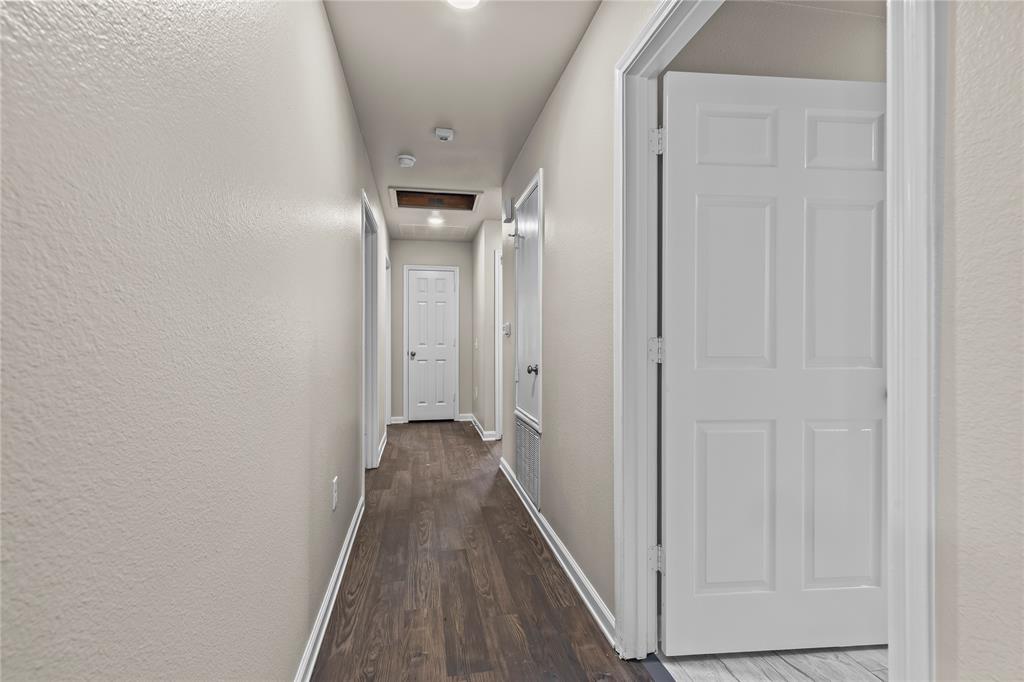 2723 Parsons Street Dallas, TX 75215 - Photo 25 of 28 a view of a hallway with wooden floor