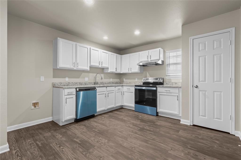 2723 Parsons Street Dallas, TX 75215 - Photo 10 of 28 a kitchen with granite countertop white cabinets and white stainless steel appliances