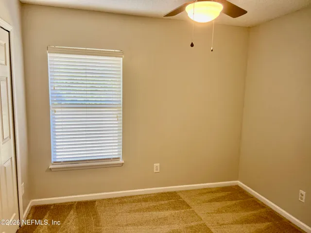 a view of a room with a window