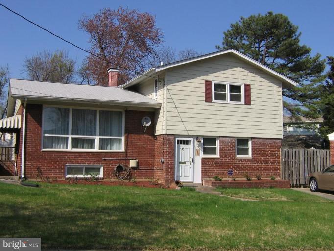 4003 Ferrara Drive Silver Spring, MD 20906 - Photo 1 of 29 a front view of a house with a garden