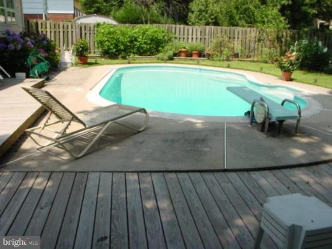 4003 Ferrara Drive Silver Spring, MD 20906 - Photo 11 of 29 a view of a swimming pool with a patio