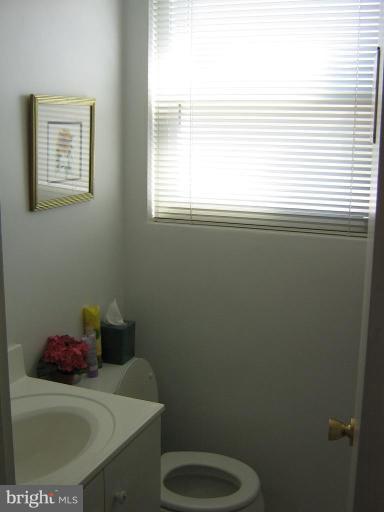 4003 Ferrara Drive Silver Spring, MD 20906 - Photo 29 of 29 a bathroom with a sink toilet and window