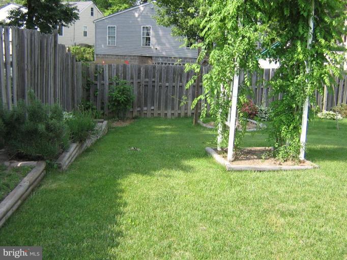 4003 Ferrara Drive Silver Spring, MD 20906 - Photo 5 of 29 a view of a house with backyard and wooden fence