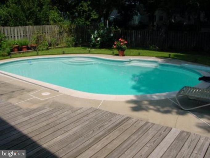 4003 Ferrara Drive Silver Spring, MD 20906 - Photo 10 of 29 a view of a swimming pool and a yard