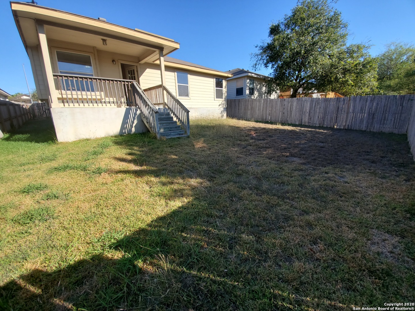 671 Rattler Bluff San Antonio, TX 78251 - Photo 13 of 15 a view of a house with a yard