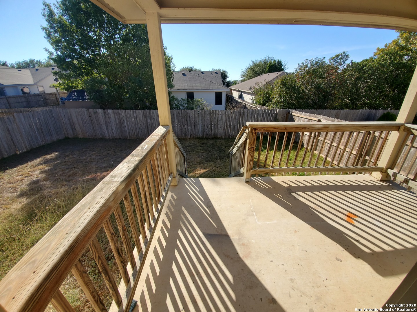 671 Rattler Bluff San Antonio, TX 78251 - Photo 14 of 15 a view of balcony with wooden floor and fence
