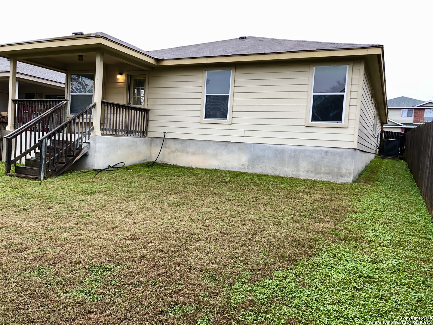 671 Rattler Bluff San Antonio, TX 78251 - Photo 15 of 15 a view of a house with a yard
