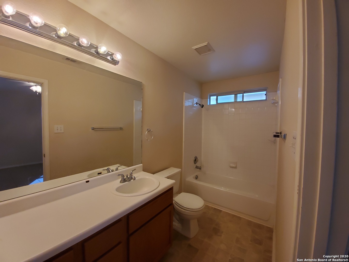 671 Rattler Bluff San Antonio, TX 78251 - Photo 10 of 15 a bathroom with a sink a toilet a mirror and shower