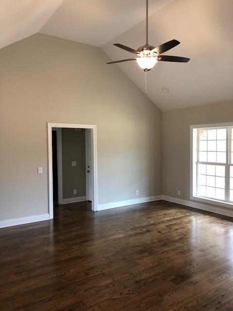 396 Coopertown Road Unionville, TN 37180 - Photo 3 of 12 Another view of the living room leading to the laundry and master bedroom.
