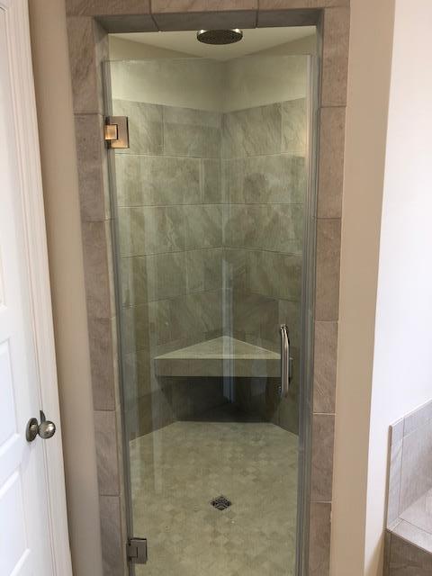 396 Coopertown Road Unionville, TN 37180 - Photo 6 of 12 Oversized tile master shower with rain head feature and bench.