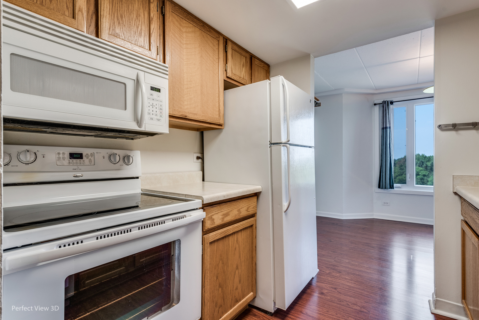 1 Renaissance Place, Unit 622 Palatine, IL 60067 - Photo 5 of 22 a kitchen with appliances and a wooden floor