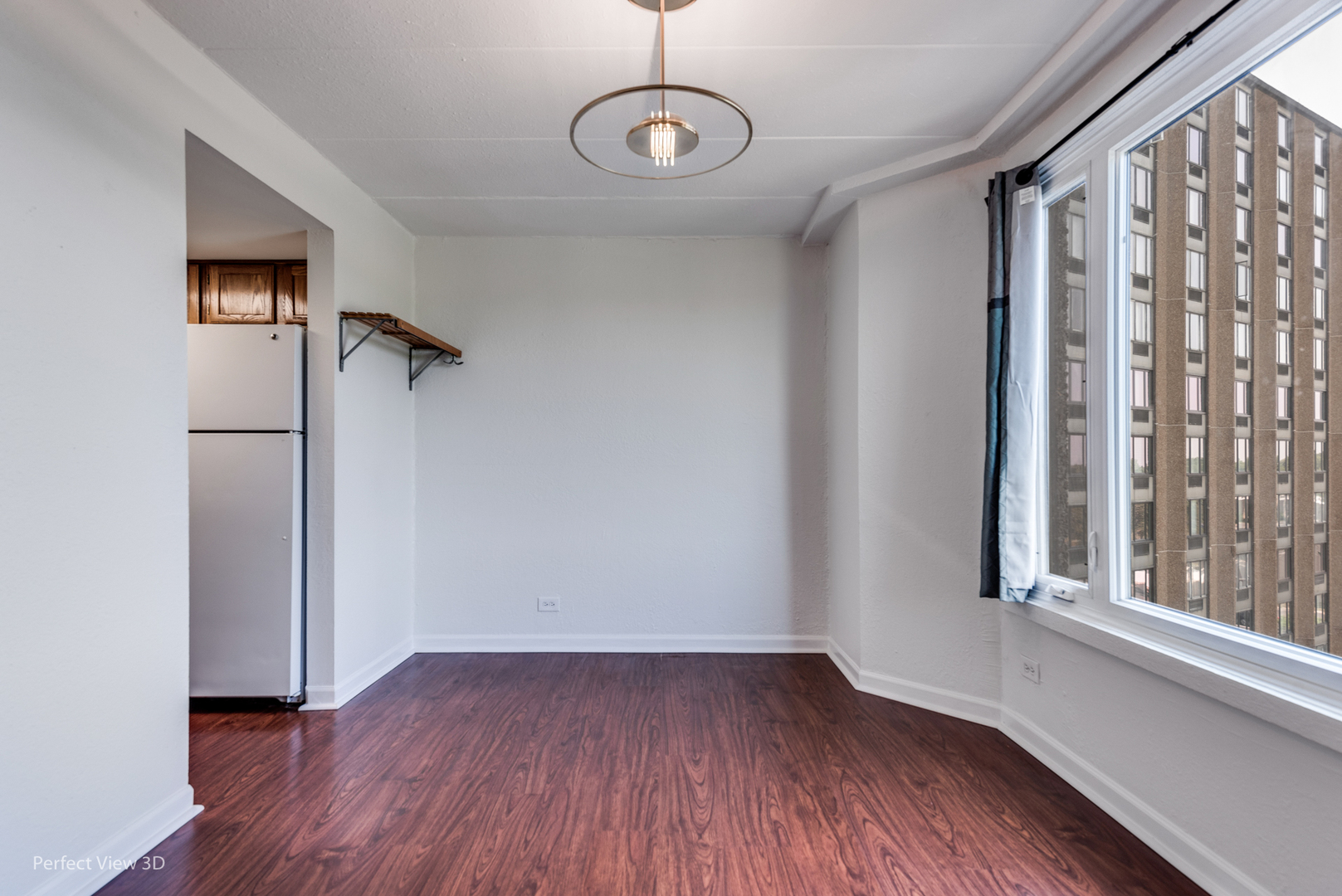 1 Renaissance Place, Unit 622 Palatine, IL 60067 - Photo 6 of 22 a view of empty room with wooden floor and fan