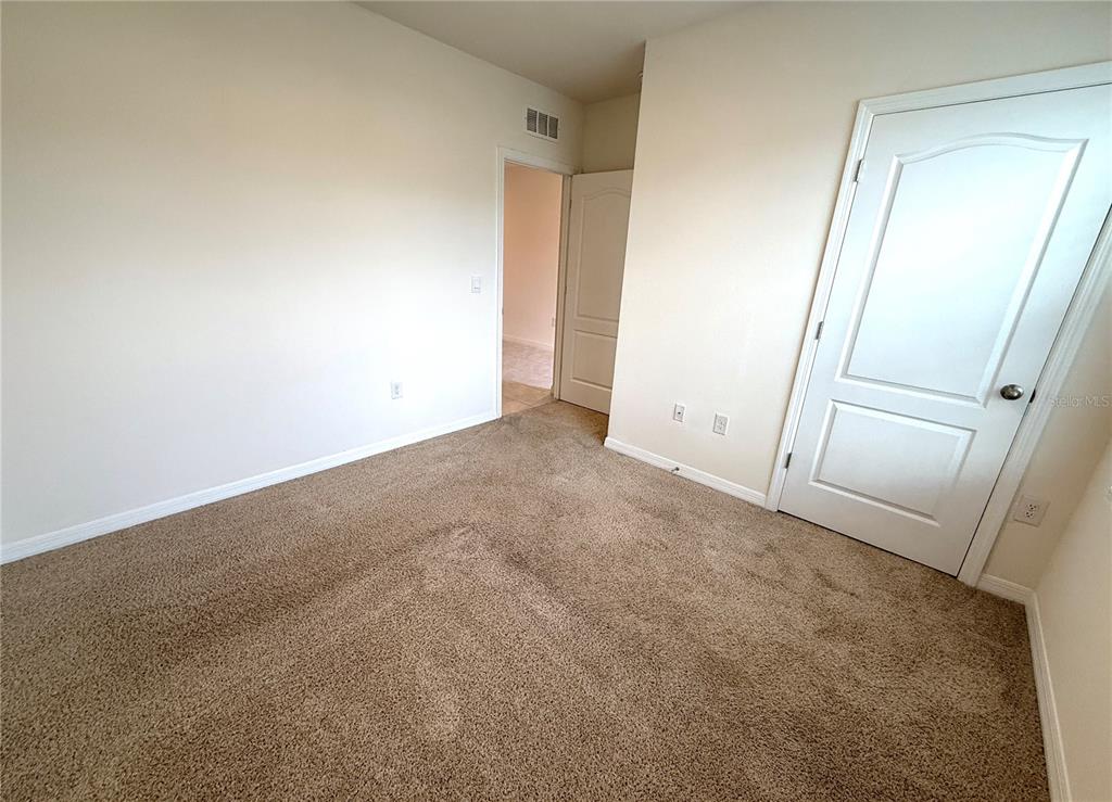 2877 Sunridge Loop St. Cloud, FL 34771 - Photo 15 of 19 an empty room with closet