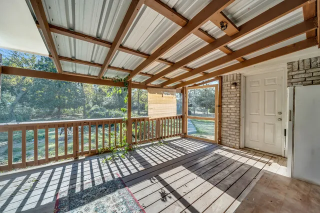 a view of a wooden balcony with wooden floor