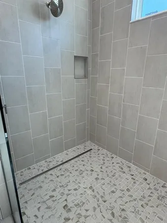 a view of kitchen with furniture and refrigerator