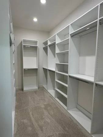 a bathroom with a shower and a sink