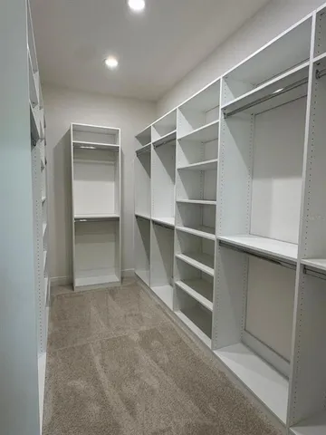 a bathroom with a shower and a sink