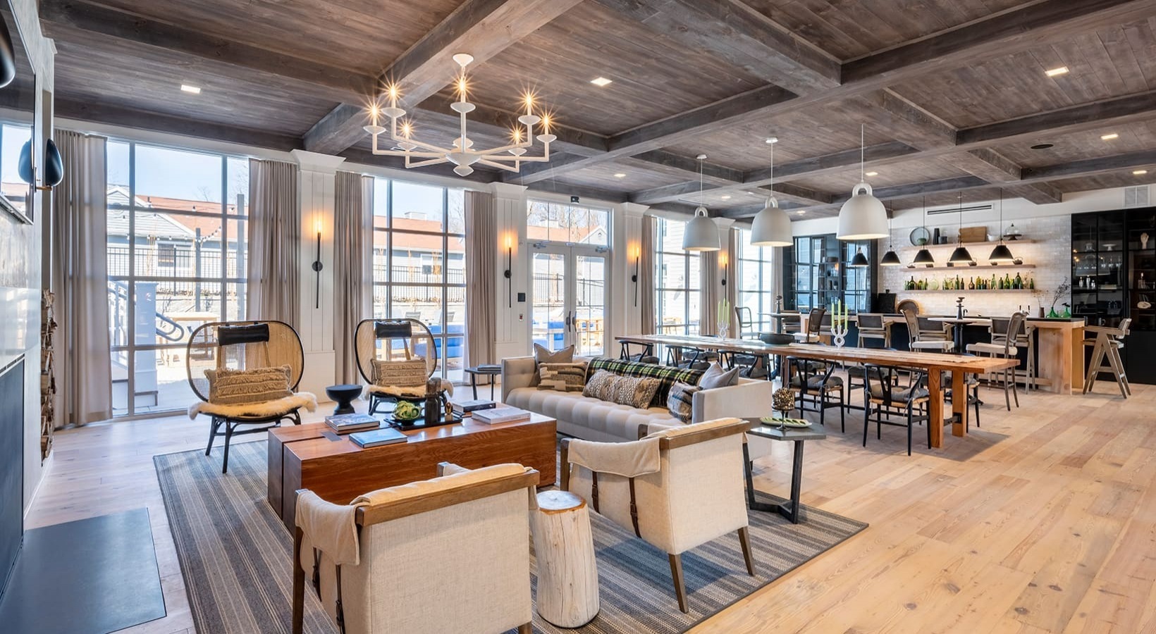 a living room with lots of furniture and a chandelier