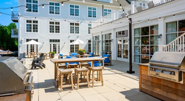 a picture of a room with a white wall and a painting