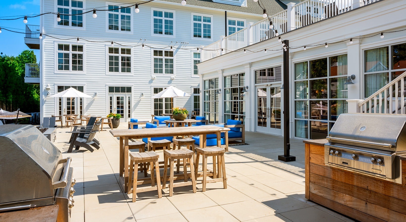 333 Unquowa Road, Unit 321 Fairfield, CT 06824 - Photo 11 of 12 a view of a dinning tables and chairs in the patio