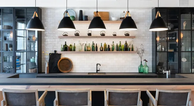 a kitchen with a sink refrigerator and microwave