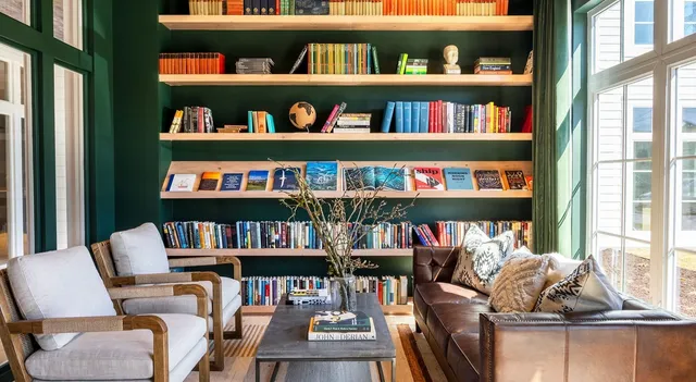 a room with furniture pool table and flat screen tv