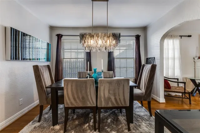 a view of a dining room with furniture and window