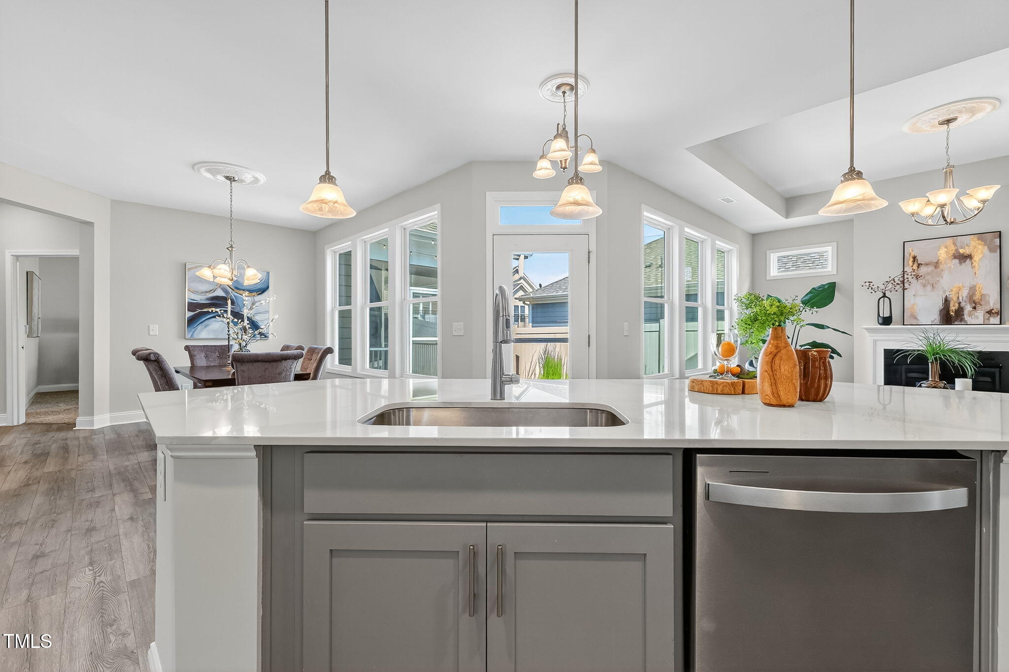 1217 Linkwood Way Fuquay-Varina, NC 27526 - Photo 12 of 44 a kitchen with a sink and chandelier