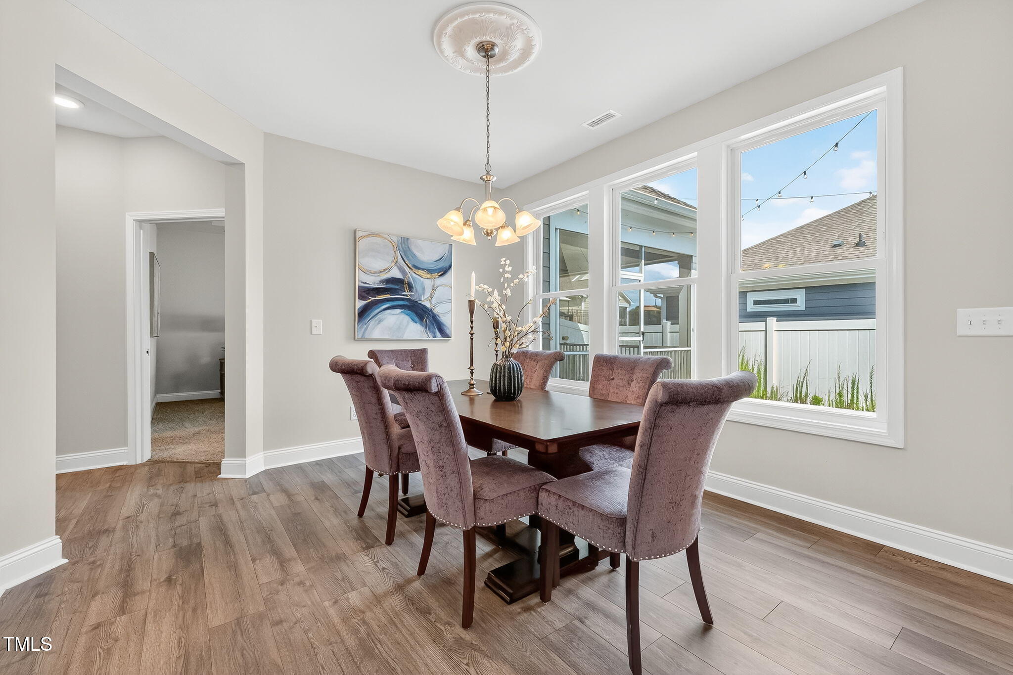 1217 Linkwood Way Fuquay-Varina, NC 27526 - Photo 17 of 44 a dining room with furniture window wooden floor