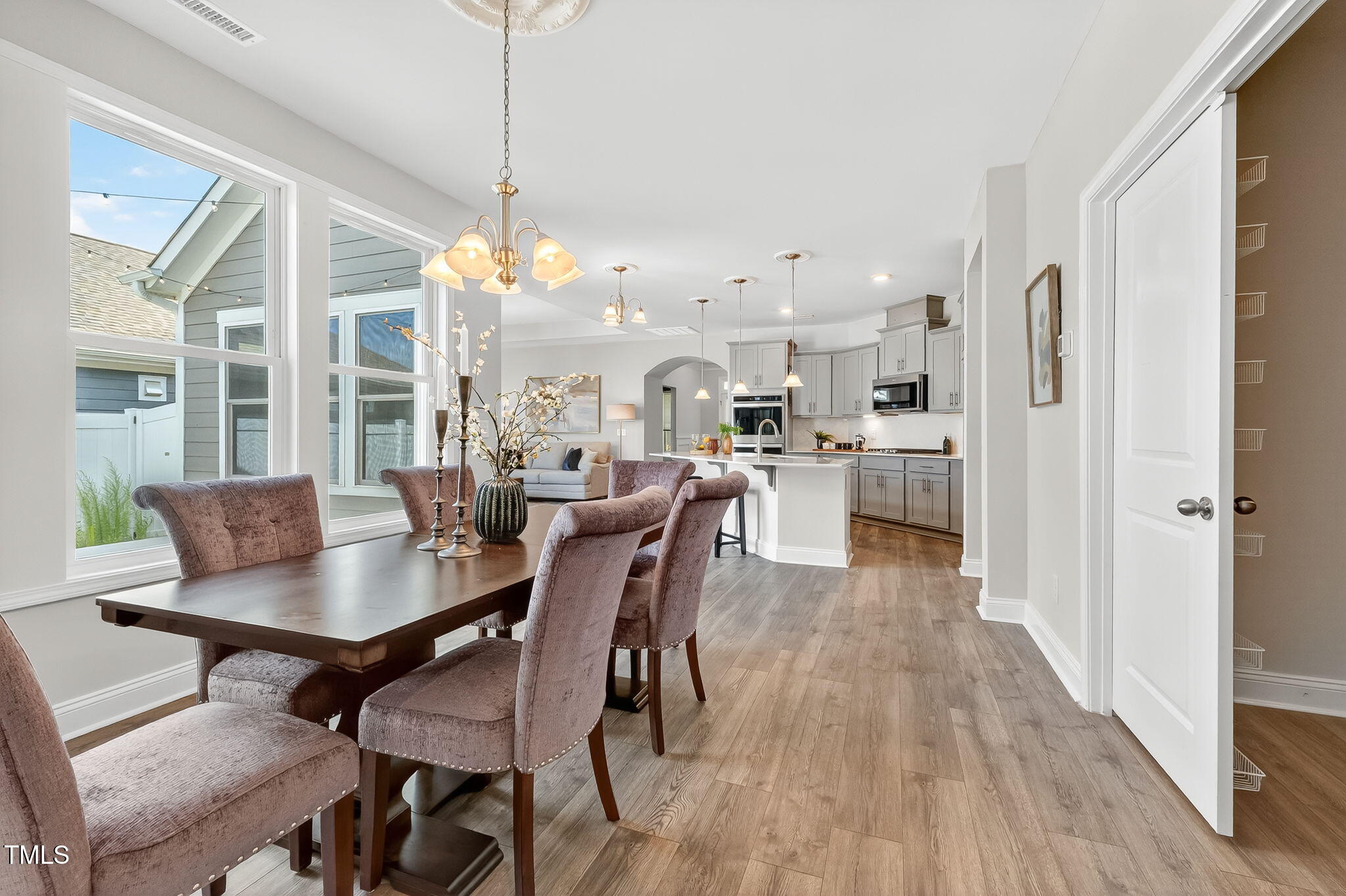 1217 Linkwood Way Fuquay-Varina, NC 27526 - Photo 19 of 44 a view of a dining room with furniture window and wooden floor