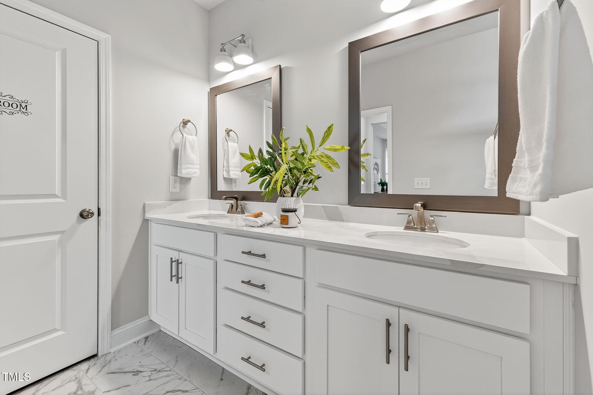 1217 Linkwood Way Fuquay-Varina, NC 27526 - Photo 26 of 44 a bathroom with double sink and a mirror