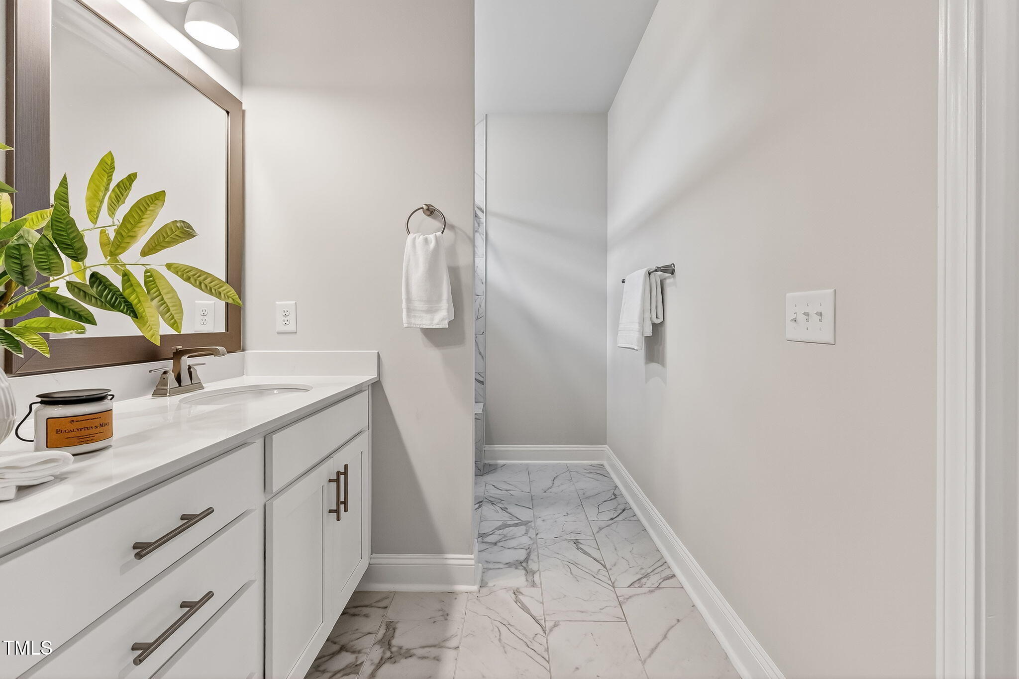 1217 Linkwood Way Fuquay-Varina, NC 27526 - Photo 28 of 44 a bathroom with a granite countertop sink and a mirror
