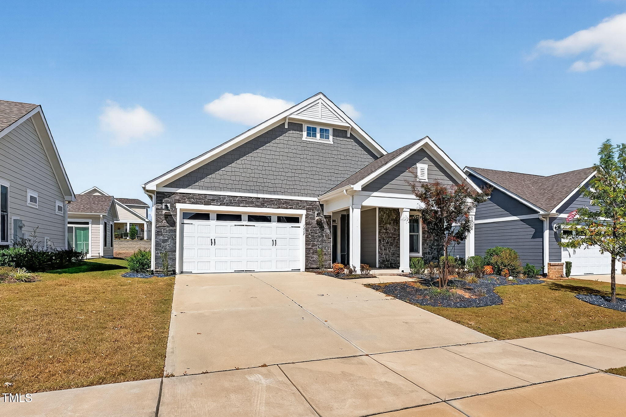 1217 Linkwood Way Fuquay-Varina, NC 27526 - Photo 4 of 44 a front view of a house with a yard