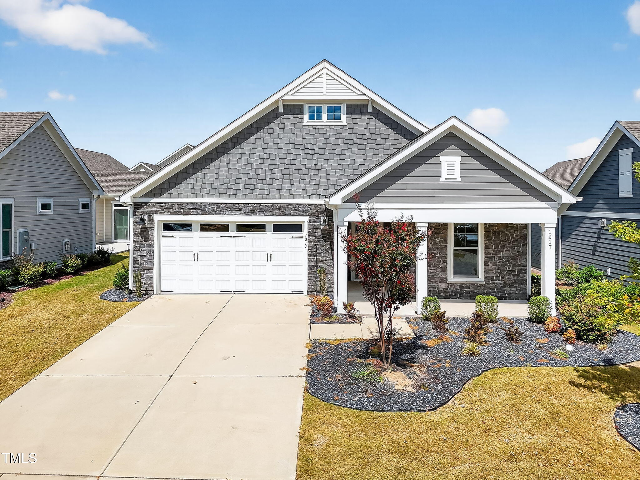 1217 Linkwood Way Fuquay-Varina, NC 27526 - Photo 41 of 44 a front view of a house with garden