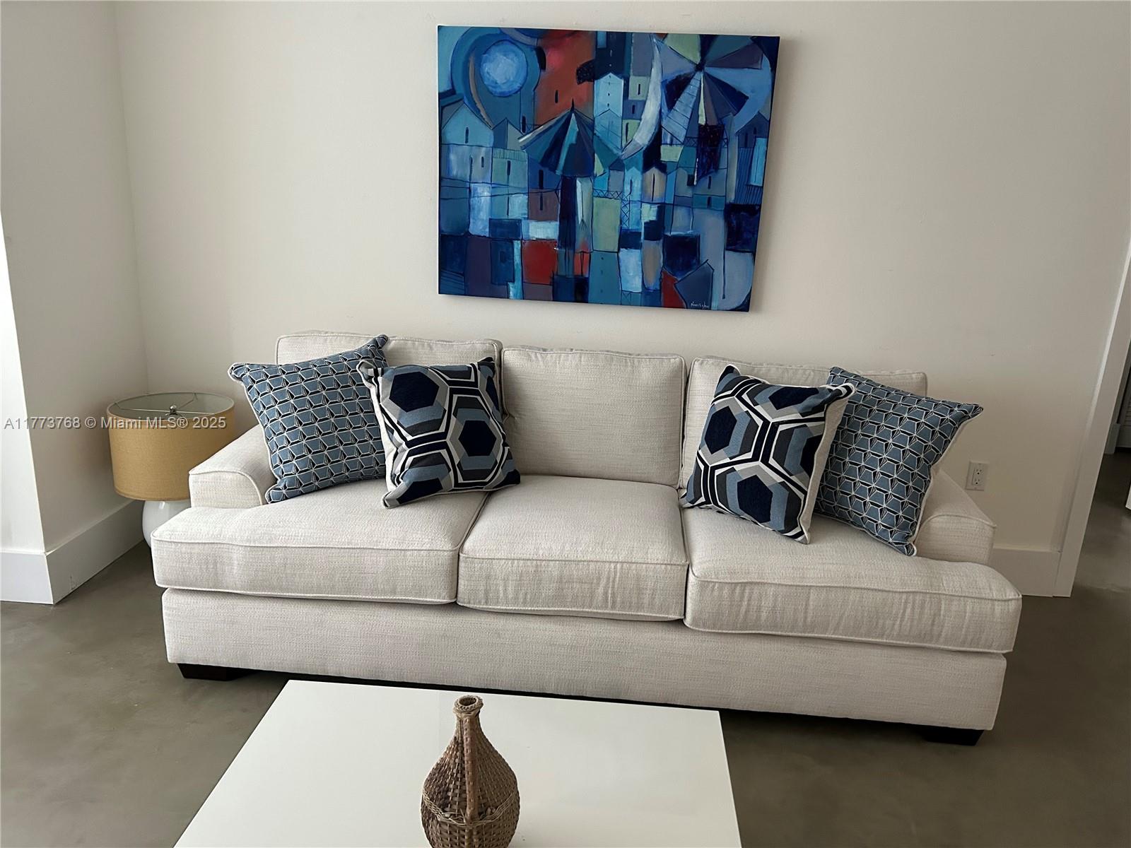 250 Galen Drive, Unit 25 Key Biscayne, FL 33149 - Photo 8 of 12 a living room with furniture and painting on the wall