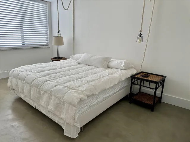 a room with a chair and a flat screen tv