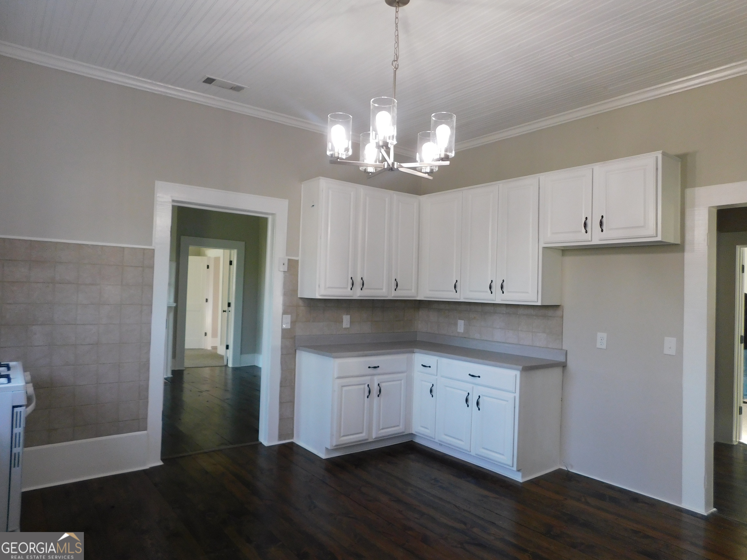 206 East Lane Street Brooklet, GA 30415 - Photo 11 of 33 a view of a kitchen with granite countertop stainless steel appliances and wooden floor