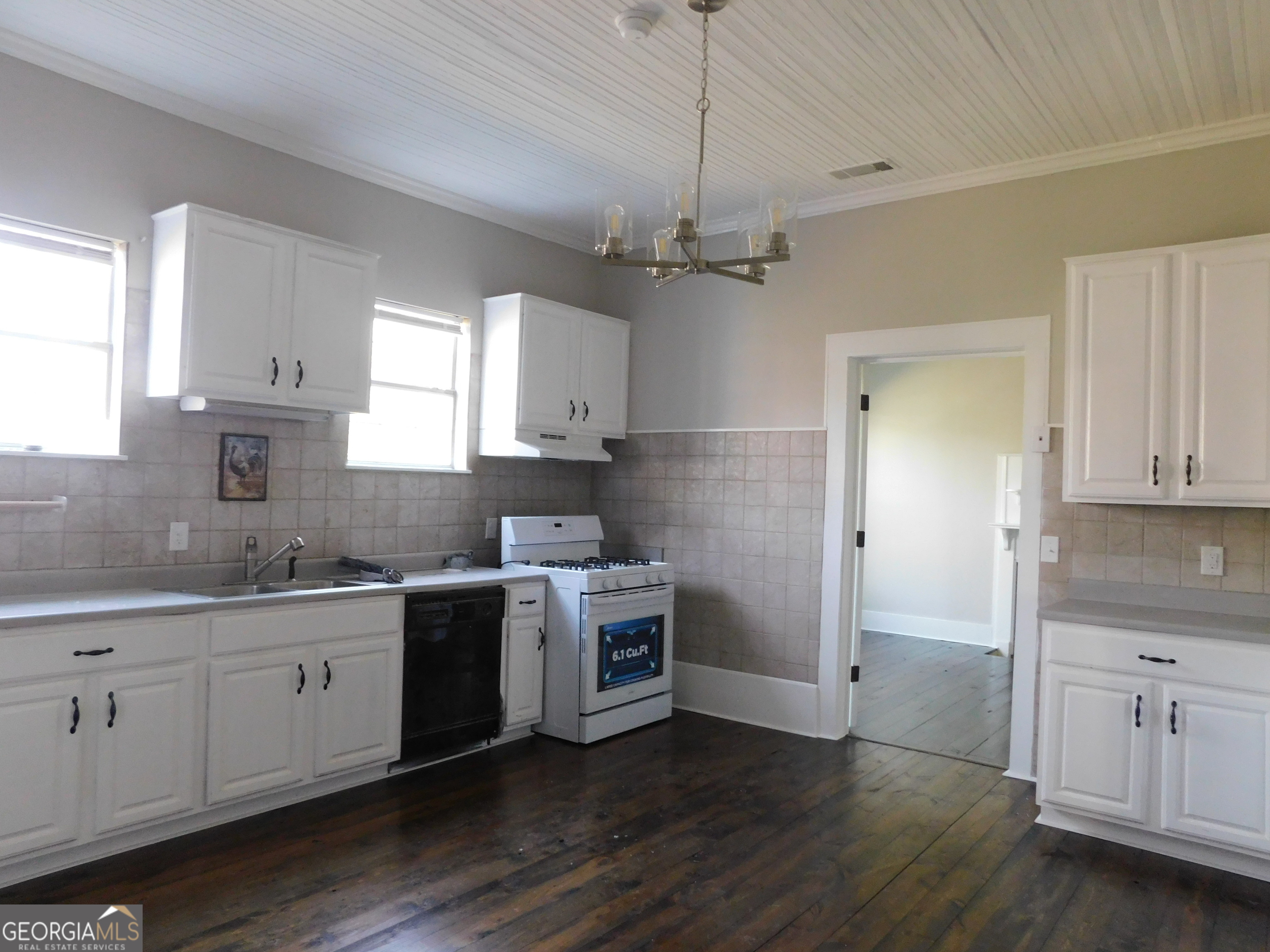 206 East Lane Street Brooklet, GA 30415 - Photo 17 of 33 a kitchen with a sink stove and cabinets