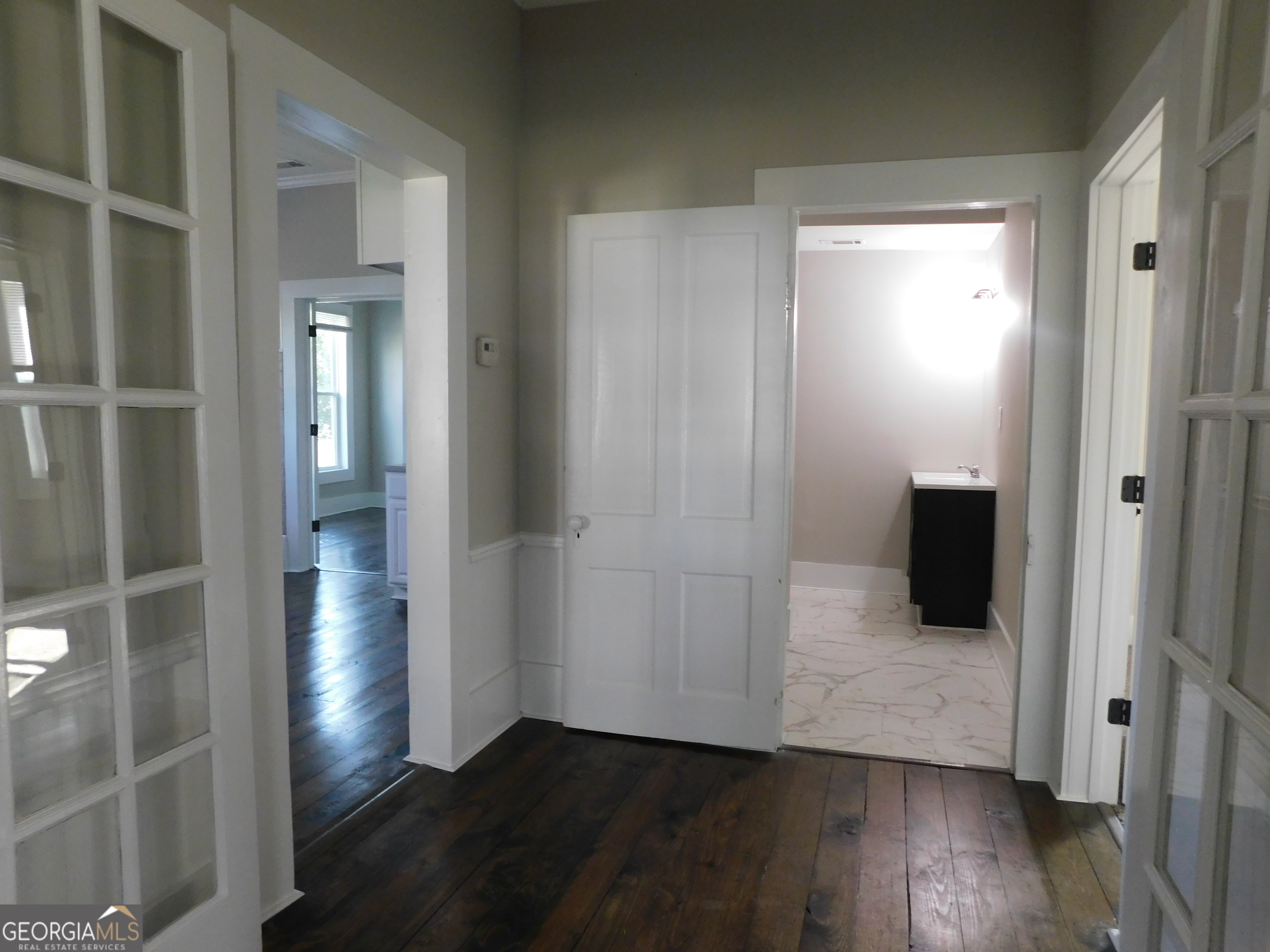 206 East Lane Street Brooklet, GA 30415 - Photo 19 of 33 a view of a hallway with wooden floor and closet
