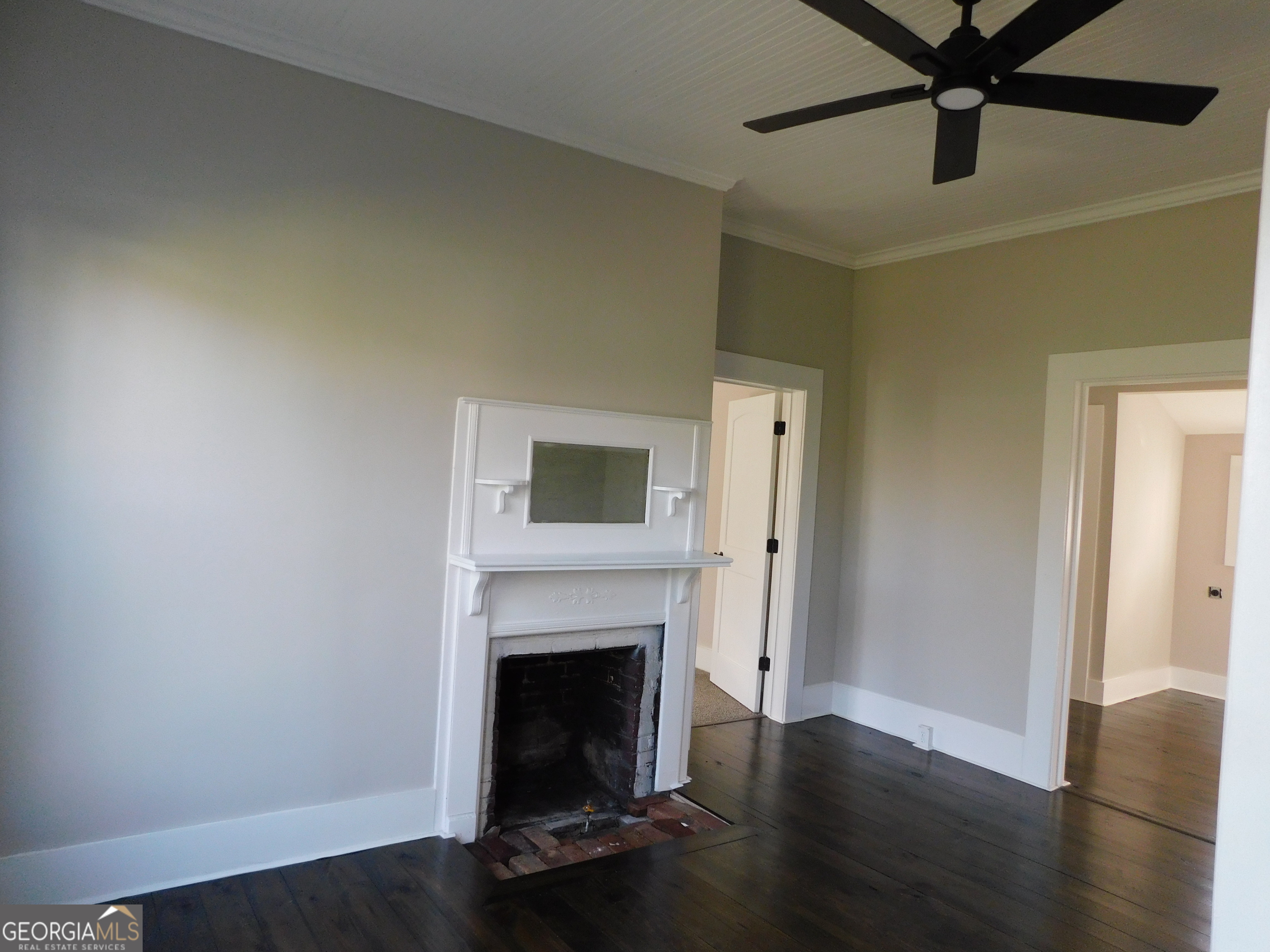 206 East Lane Street Brooklet, GA 30415 - Photo 20 of 33 a living room with wooden floor and a fireplace