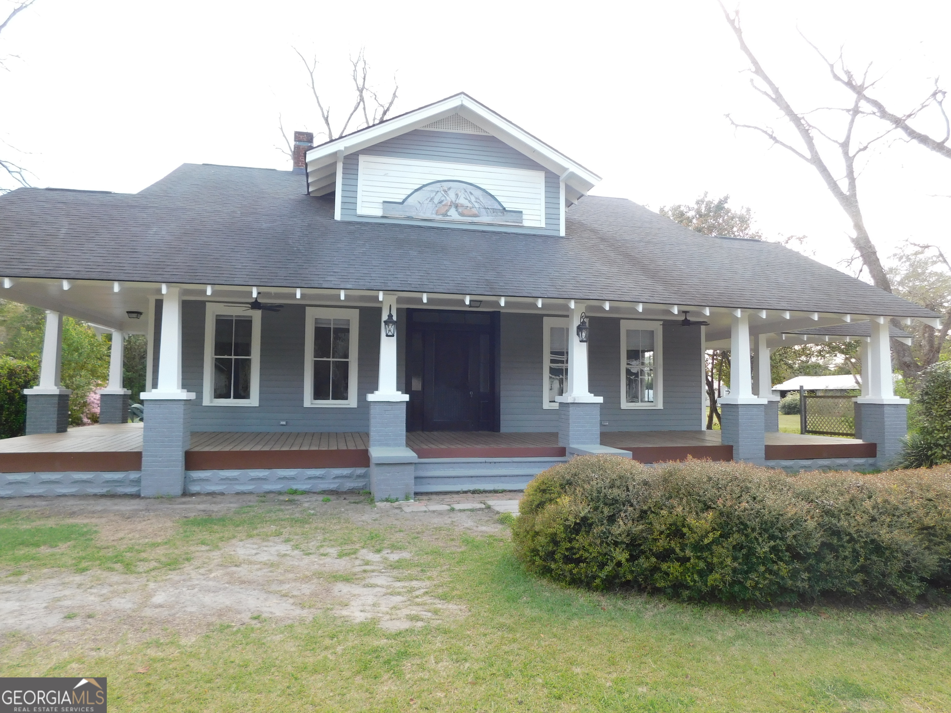 206 East Lane Street Brooklet, GA 30415 - Photo 2 of 33 a front view of a house with garden