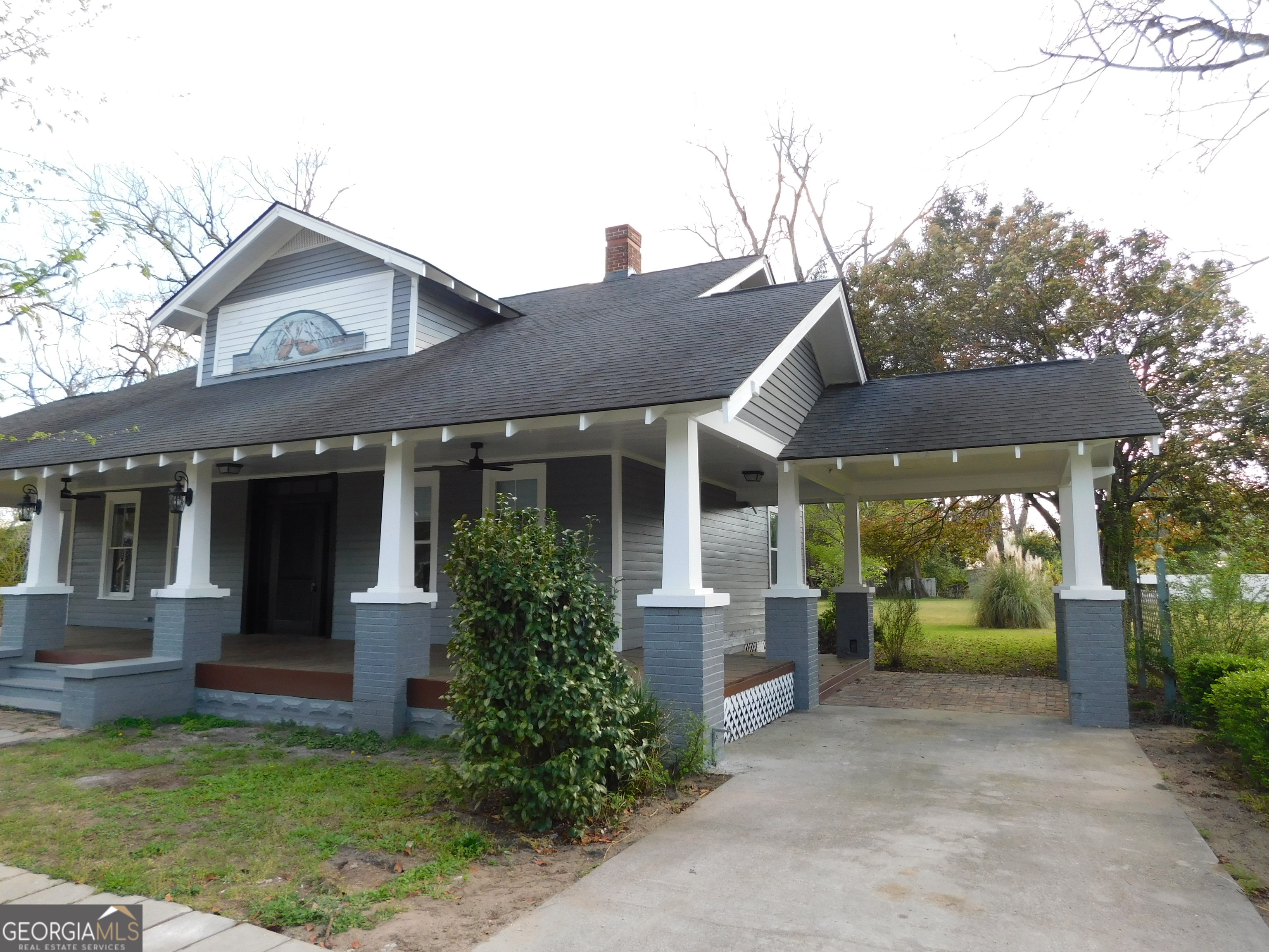 206 East Lane Street Brooklet, GA 30415 - Photo 28 of 33 a view of a house with garden and plants